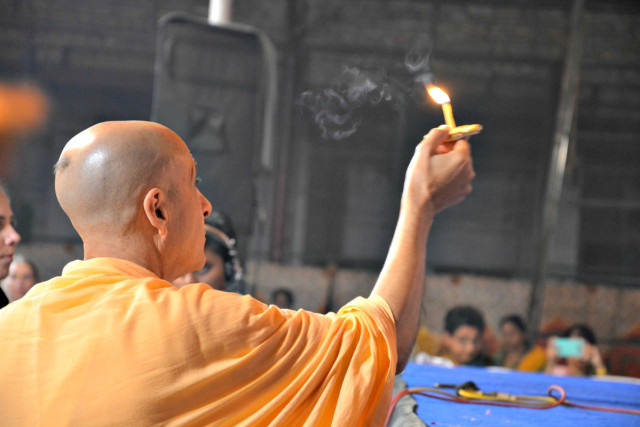 Radhanath Swami offering Lamp to Radha Damodar