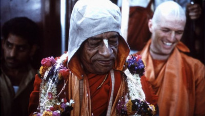 Srila Prabhupada with Madhudvisa Swami smiling in the background
